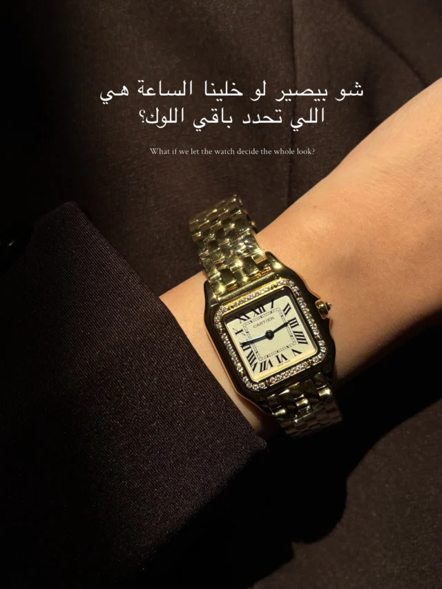 Gold watch styled with a dark outfit